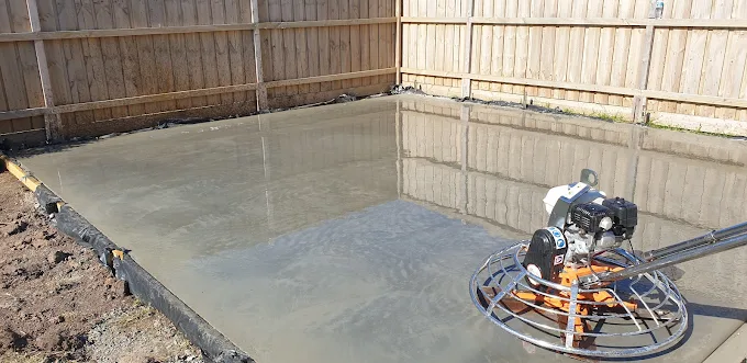 Concrete slab with power trowel finish