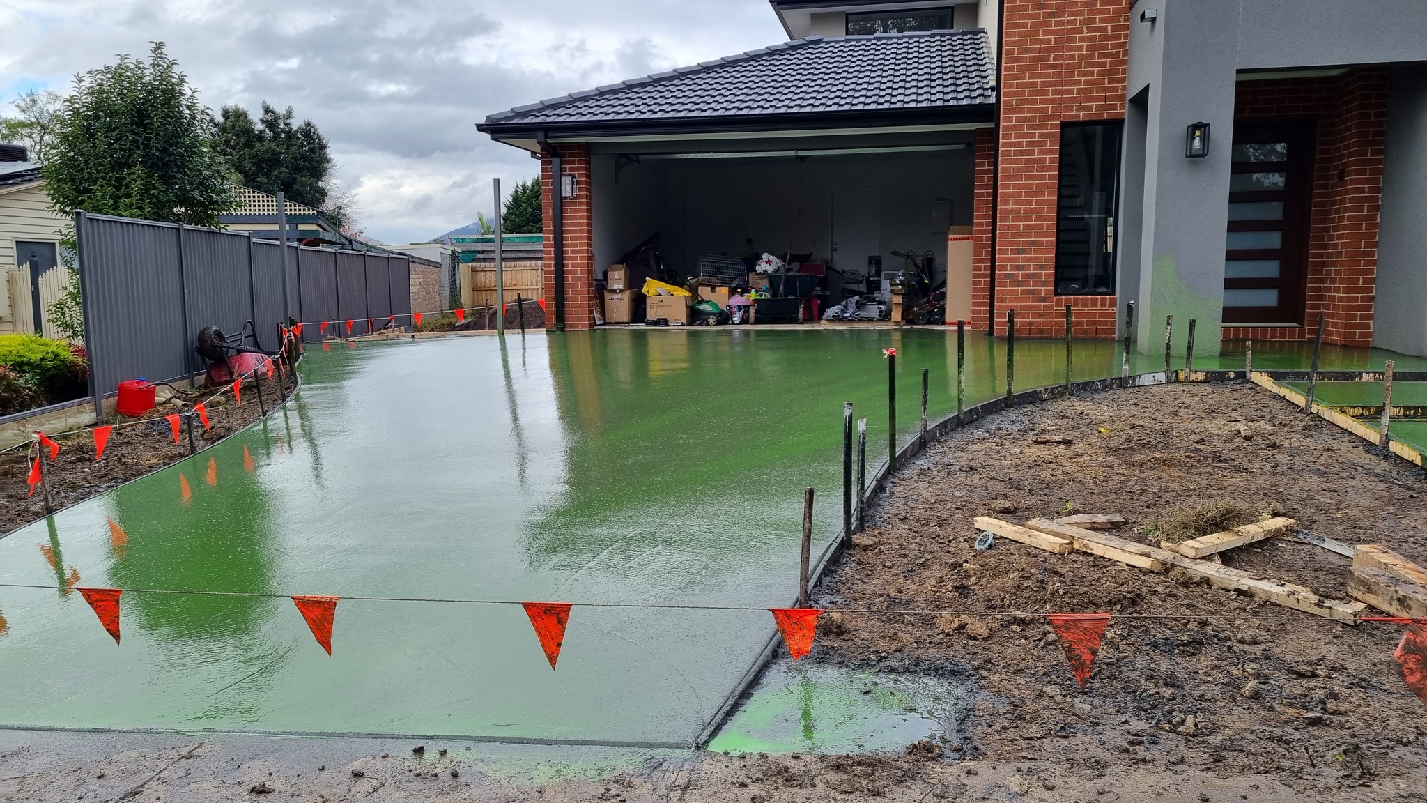 Concrete driveway finished and sealed by Wade Concreting